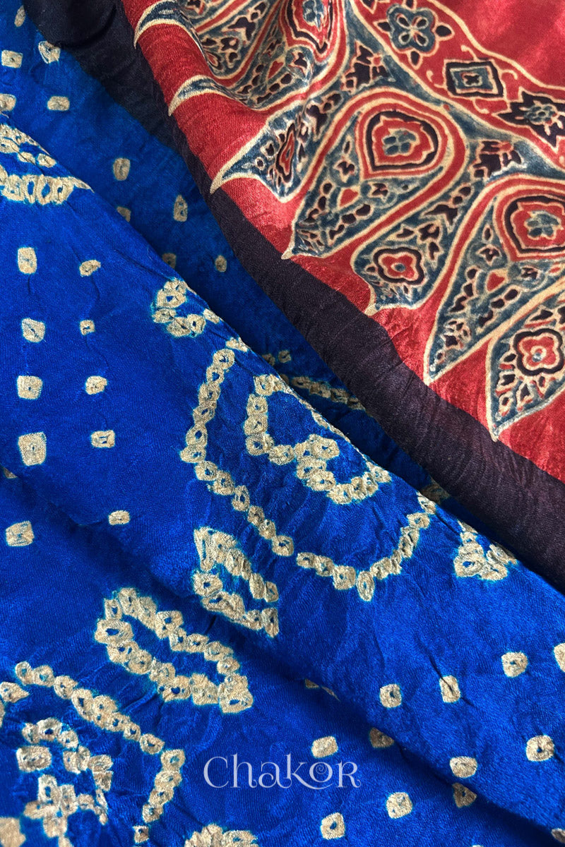 Close up of Blue Bandhani Saree with Natural Red Ajrakh printed border and pallu in pure gaji silk with traditional bandhej tie-dye, handcrafted in Kutch. 