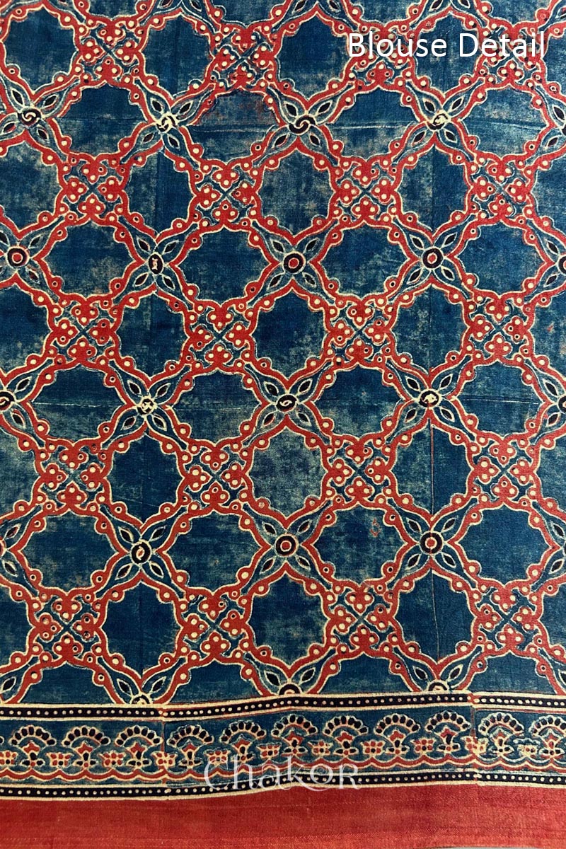 Close up of Blue Bandhani Saree with Natural Red Ajrakh printed border and pallu in pure gaji silk with traditional bandhej tie-dye, handcrafted in Kutch. 