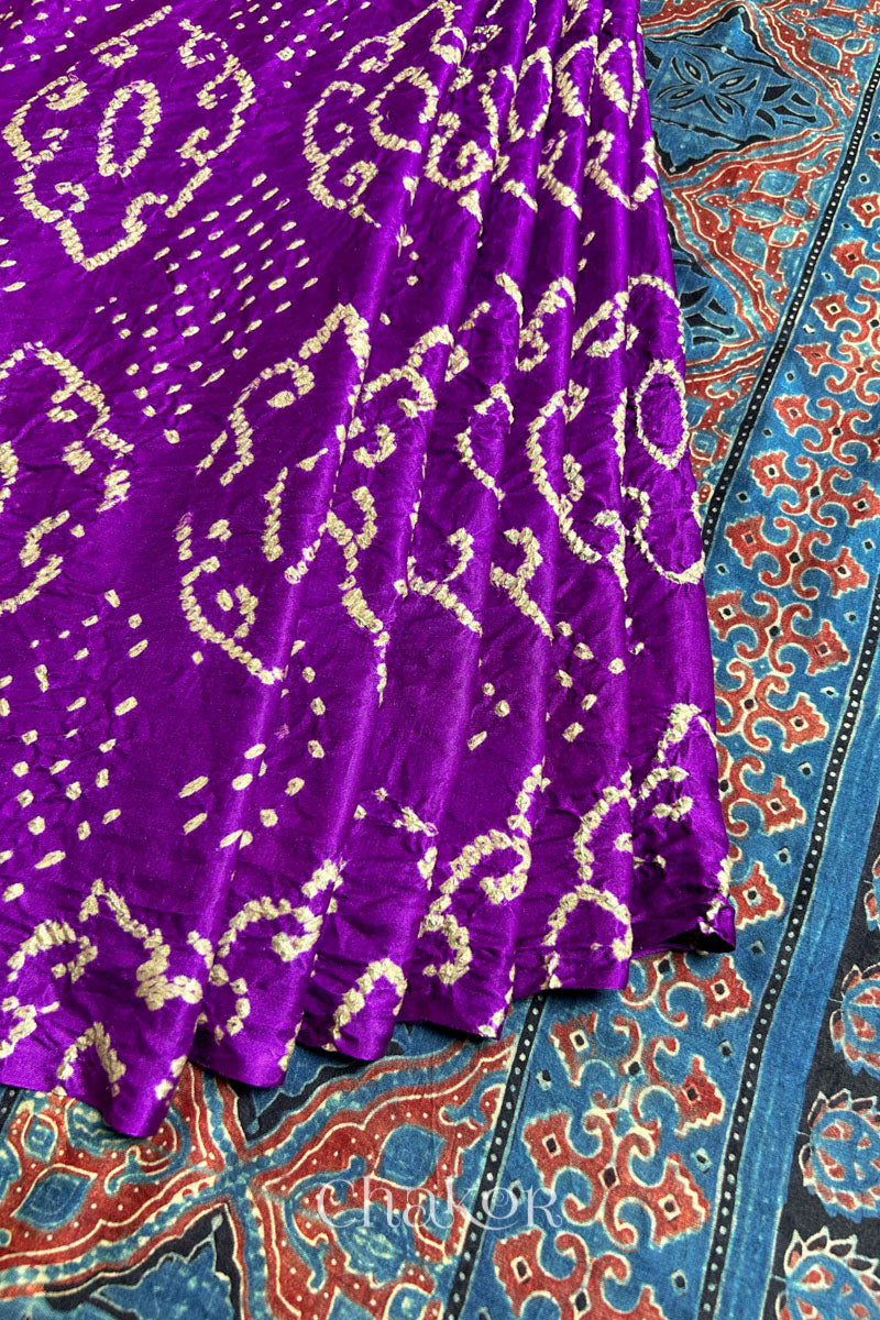 Close up of  Purple Bandhani Saree with Indigo Ajrakh printed pallu in pure gaji silk with traditional bandhej tie-dye, handcrafted in Kutch. 