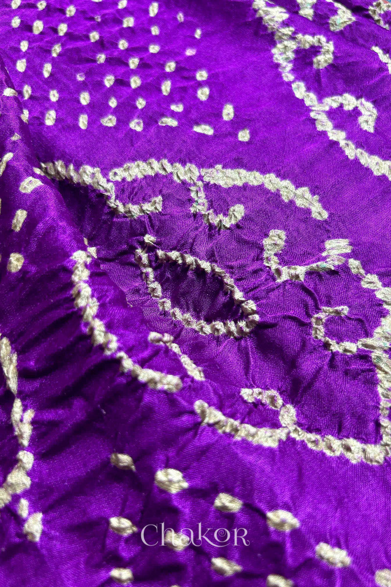 Close up of  Purple Bandhani Saree with Indigo Ajrakh printed pallu in pure gaji silk with traditional bandhej tie-dye, handcrafted in Kutch. 