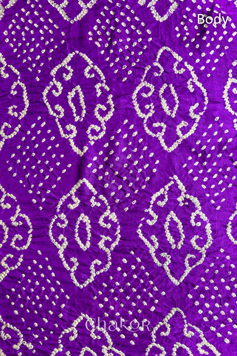 Close up of  Purple Bandhani Saree with Indigo Ajrakh printed pallu in pure gaji silk with traditional bandhej tie-dye, handcrafted in Kutch. 