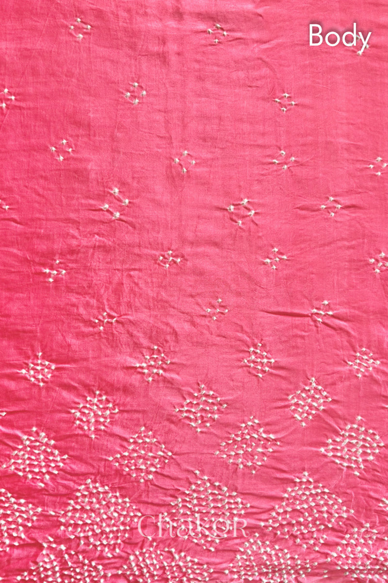 Body detail of Handcrafted Coral Pink Bandhani Gaji Silk Saree with rai bandhej patterns and tissue pallu.