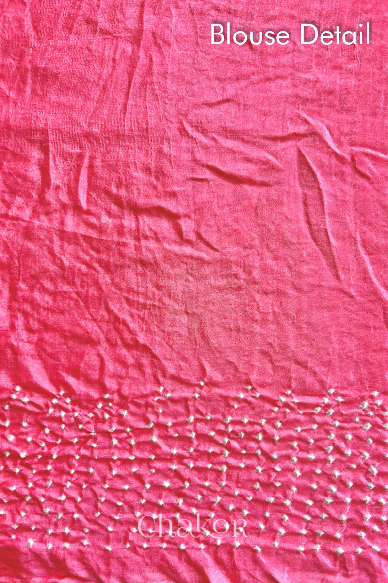 Blouse fabric detail of Handcrafted Coral Pink Bandhani Gaji Silk Saree with rai bandhej patterns and tissue pallu.