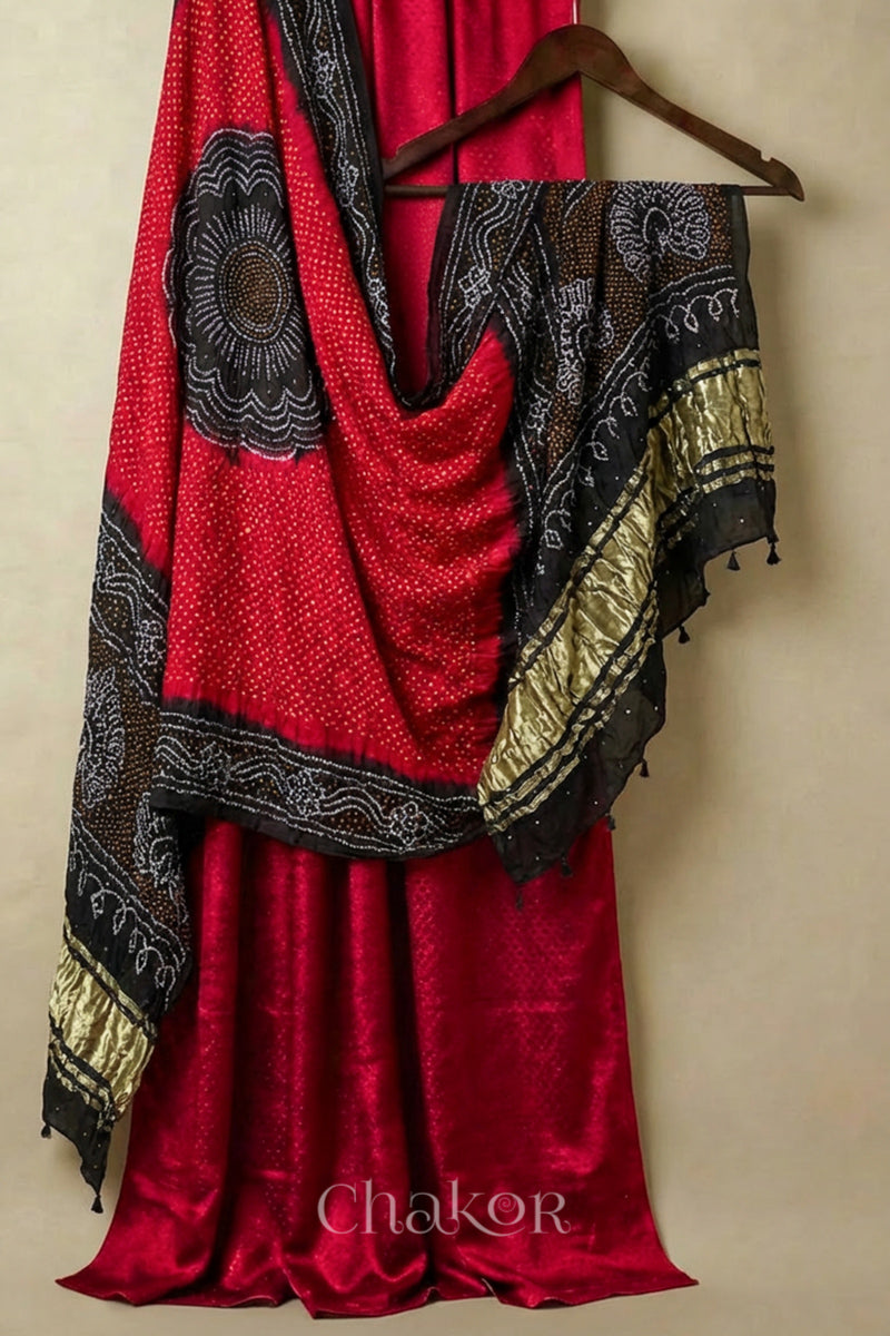 Red Unstitched Mashru Silk Kurta Set  Material paired with Handcrafted Red Bandhani Gaji silk dupatta with black peacock pallu and borders.