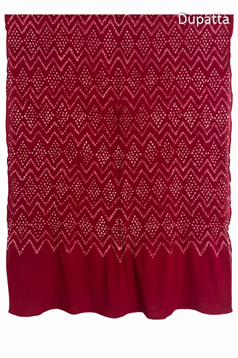 Full view of the red dupatta from the kurta set with intricate zigzag bandhani patterns, with Chakor logo. The design showcases artisanal craftsmanship.