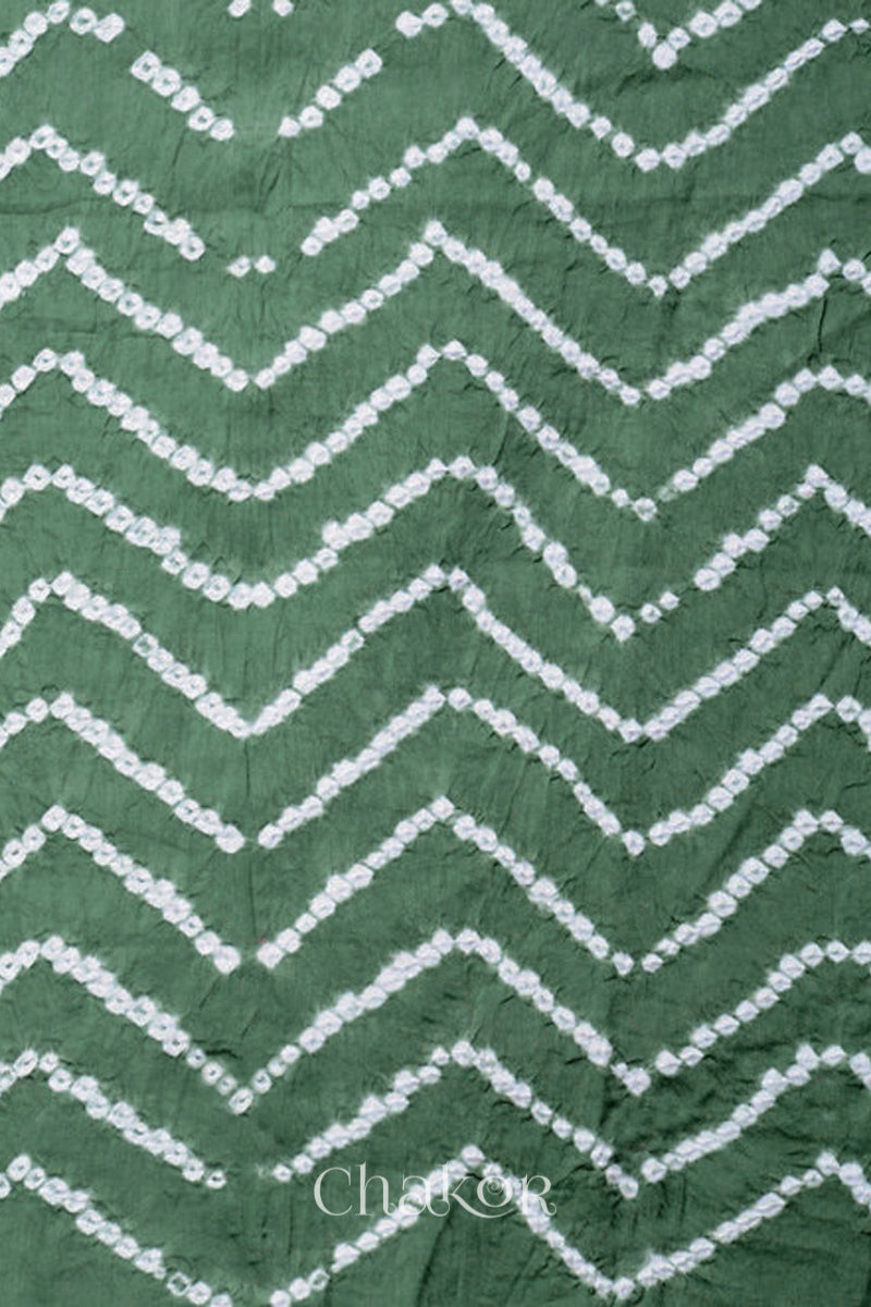Close-up of bandhani sleeve detail featuring chevron tie-dye design, with Chakor brand logo.
