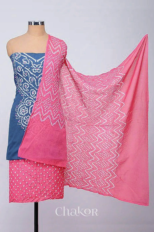 A stylish kurta set fabric featuring a blue grey mirror embroidered top, a bandhani pink bottom, and a matching pink dupatta draped elegantly. Text reads Chakor.
