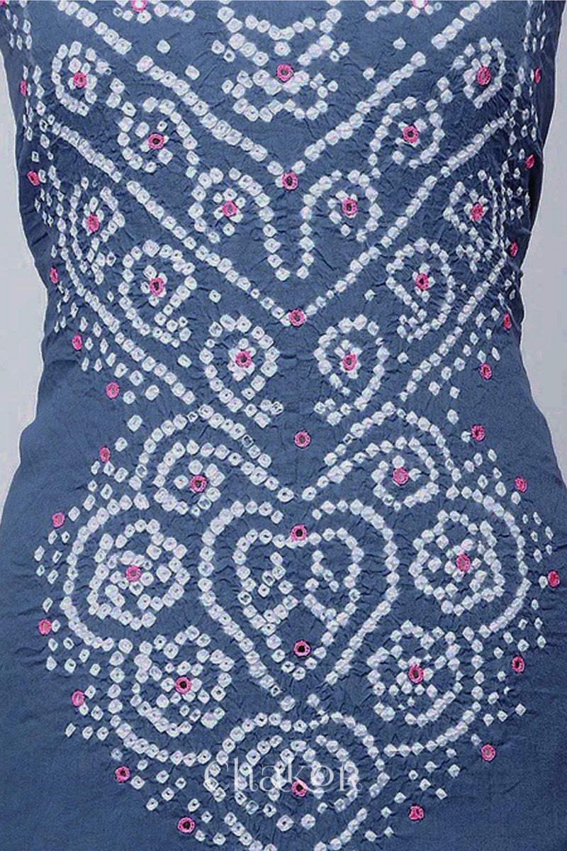 Close-up of bandhani yoke kurta fabric featuring floral & spiral tie-dye design and pink mirror embroidery, with Chakor brand logo.
