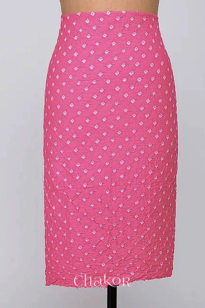 Bottom fabric in pink patterned with simple bandhani tie dye dots, draped neatly on a dress form, with Chakor brand logo.
