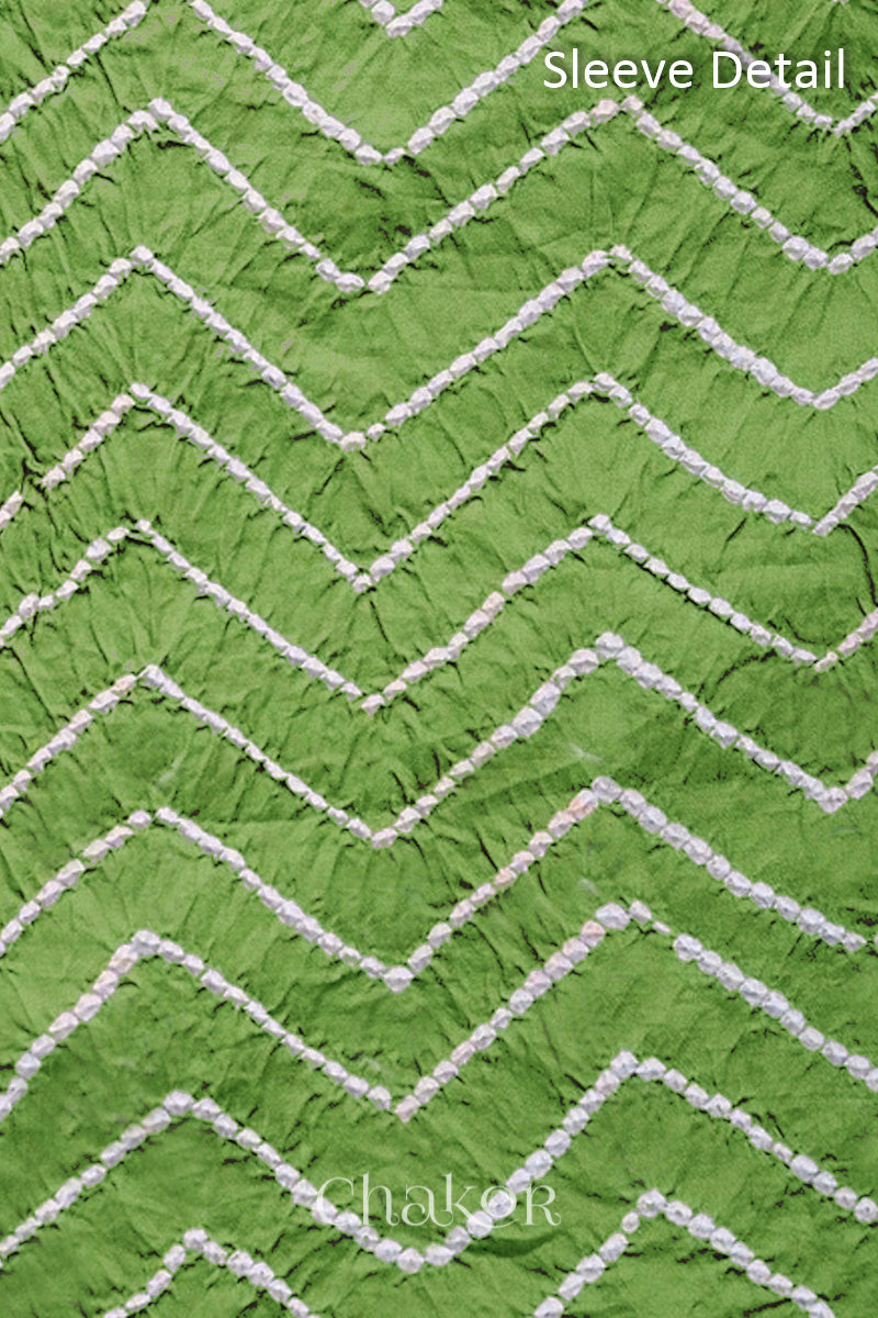 Close-up of bandhani sleeve detail featuring chevron tie-dye design, with Chakor brand logo.
