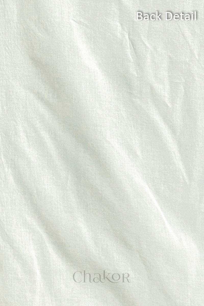 Close-up of plain back of the kurta fabric with Chakor brand logo. Text reads back detail.