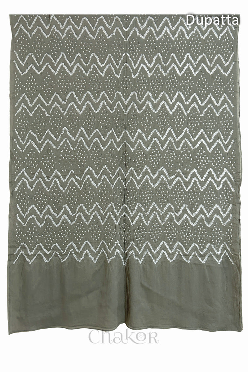 Full view of the dupatta from the kurta set with intircate zigzag bandhani patterns,  with Chakor logo. The design showcases artisanal craftsmanship.