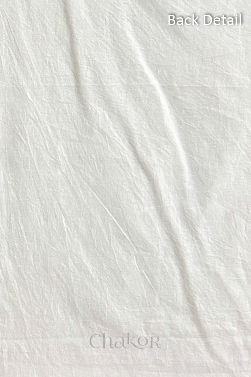Close-up of plain back of the kurta fabric with Chakor brand logo. Text reads back detail.