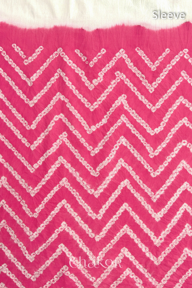 Close-up of bandhani fabric featuring chevron tie-dye design, with Chakor brand logo. Text reads sleeve details.