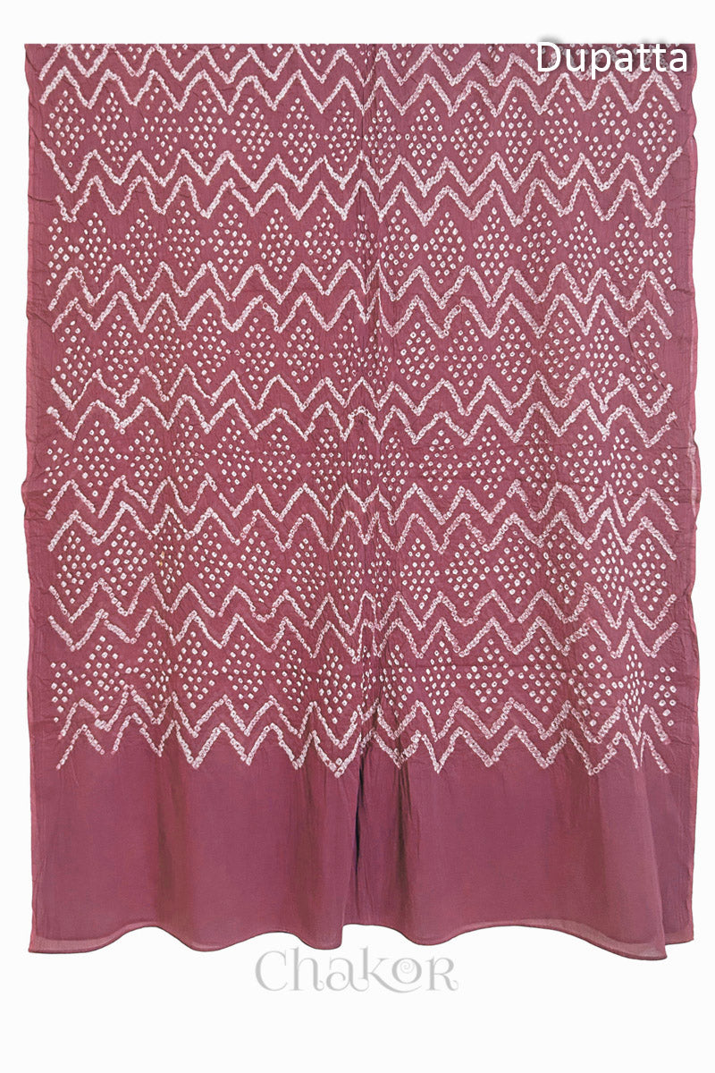 Full view of the soft rose pink dupatta from the kurta set with intircate zigzag bandhani patterns,  with Chakor logo. The design showcases artisanal craftsmanship.