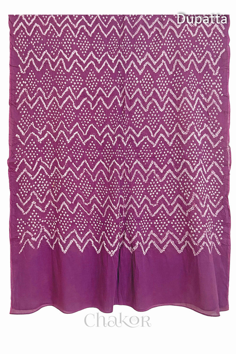 Full view of the deep violet dupatta from the kurta set with intircate zigzag bandhani patterns,  with Chakor logo. The design showcases artisanal craftsmanship.