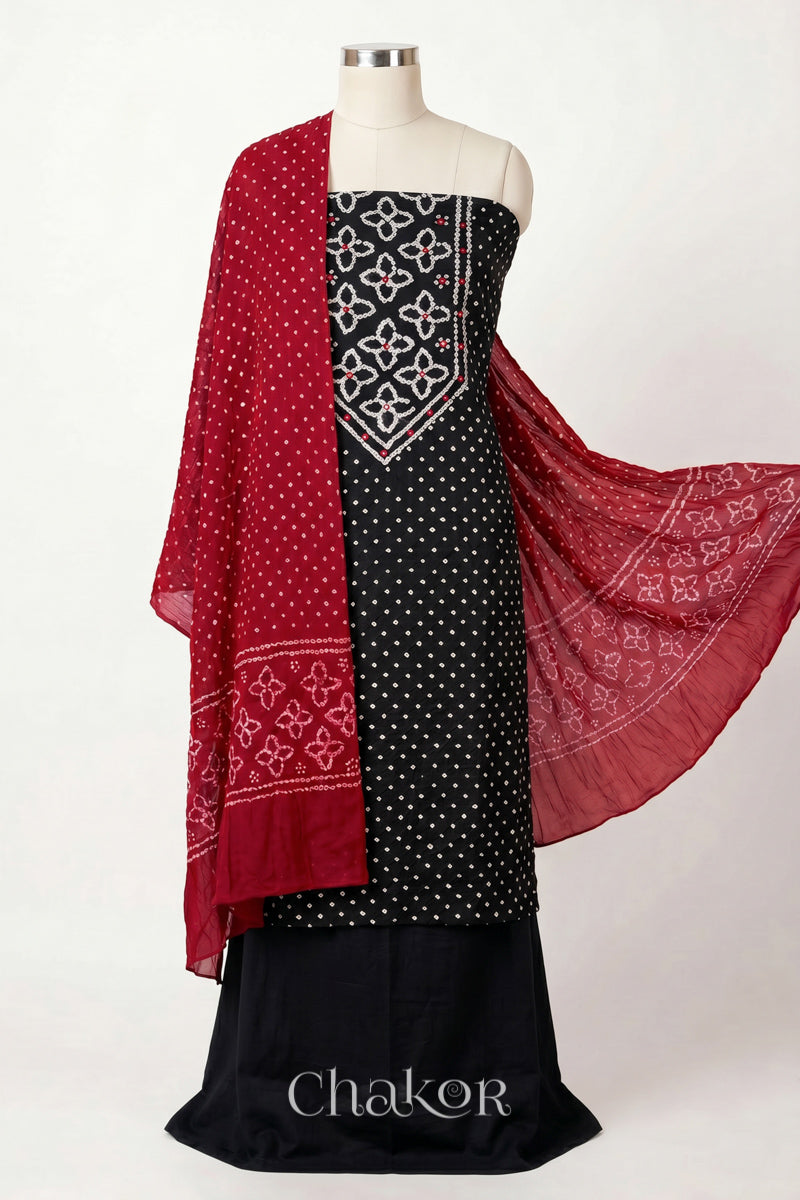 Black Kutch Bandhani cotton unstitched suit set, mirror work kurta with Red mulmul cotton dupatta.
