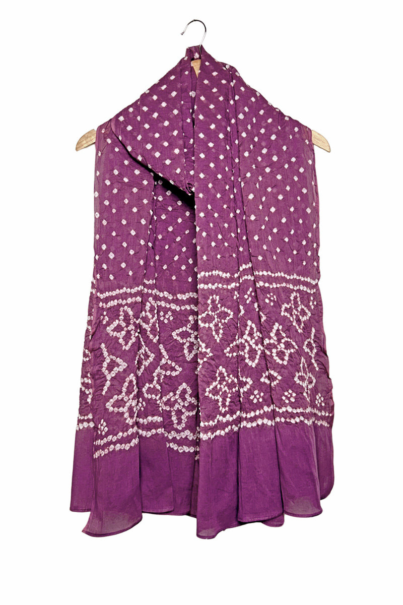 Red mercerised mulmul cotton dupatta with Bandhani floral pallu design draped on hanger.
