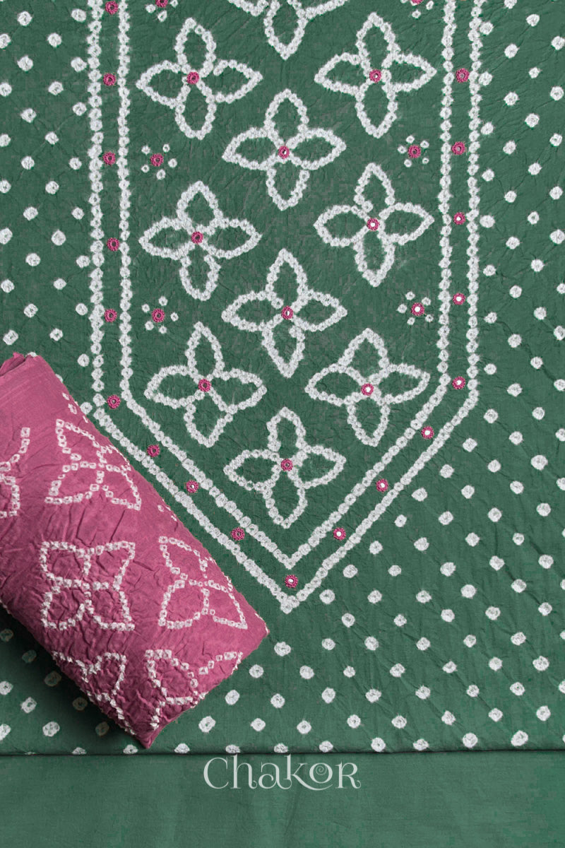 Front yoke detail of Moss Green Bandhani cotton kurta fabric with hand embroidery and mirror work and Old Rose dupatta rolled up.
