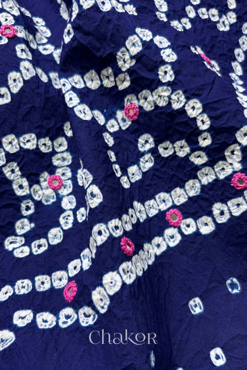 Hand tied Bandhani floral motif with colourful mirror embroidery on Navy Blue cotton fabric.
