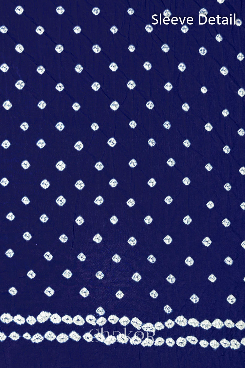 Bandhani dotted sleeve pattern on mercerised cotton fabric with handcrafted tie dye work.
