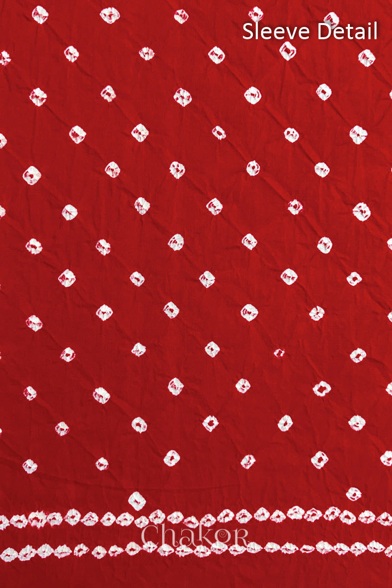 Bandhani dotted sleeve pattern on mercerised cotton fabric with handcrafted tie dye work.
