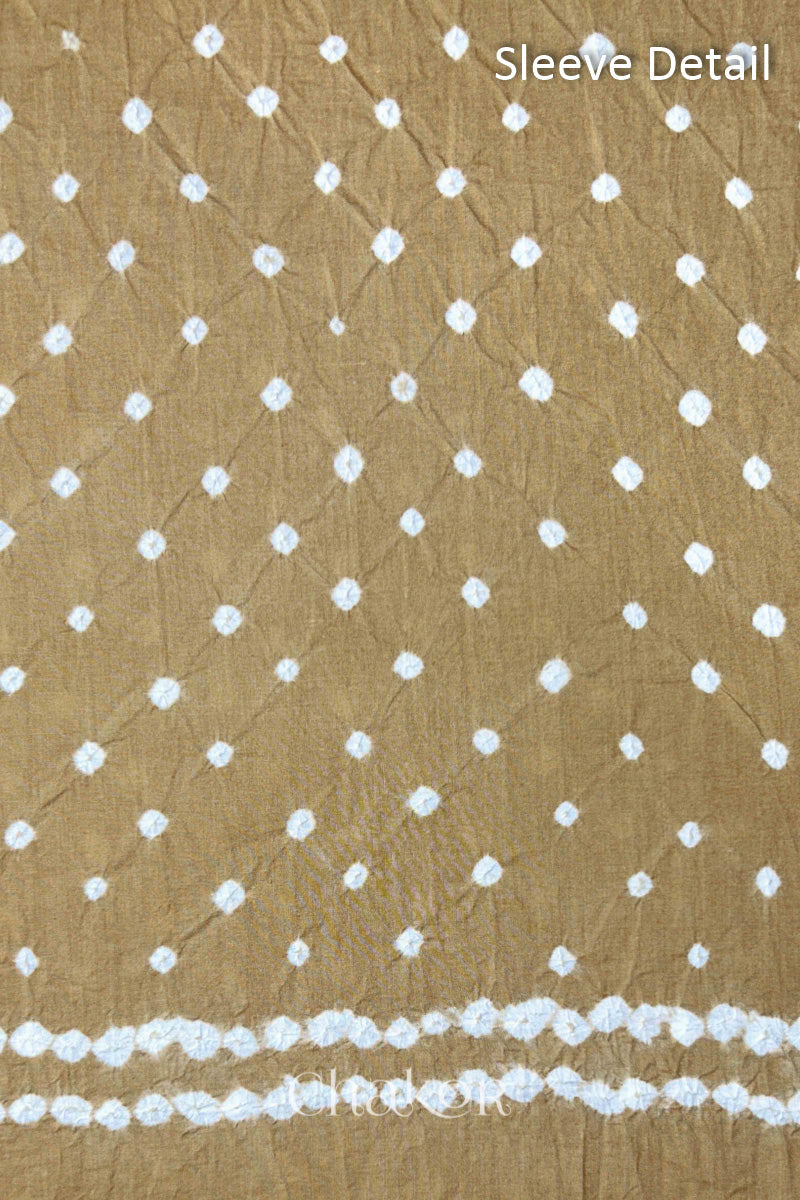 Bandhani dotted sleeve pattern on mercerised cotton fabric with handcrafted tie dye work.
