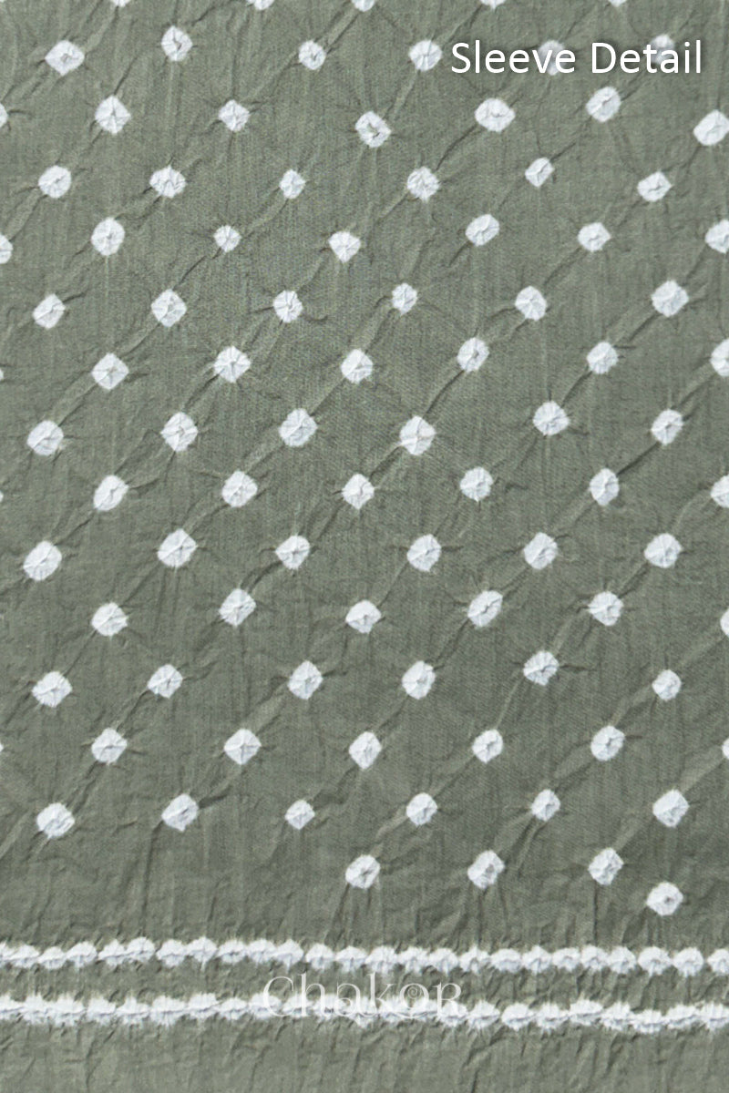 Bandhani dotted sleeve pattern on mercerised cotton fabric with handcrafted tie dye work.
