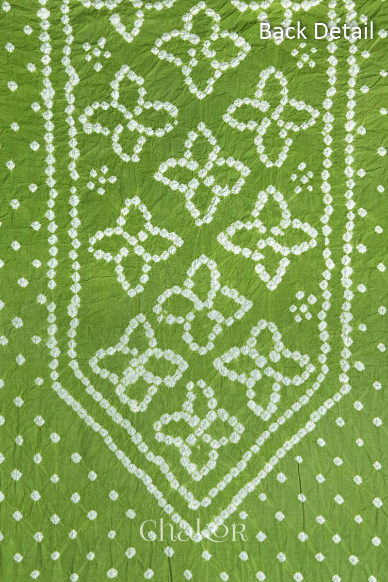 Back yoke detail featuring traditional Bandhani floral motifs on Green cotton fabric.
