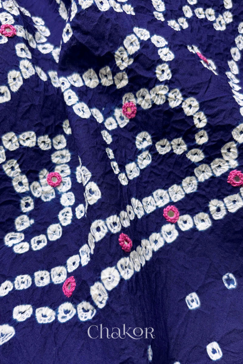Hand tied Bandhani floral motif with colourful mirror embroidery on Navy Blue cotton fabric.
