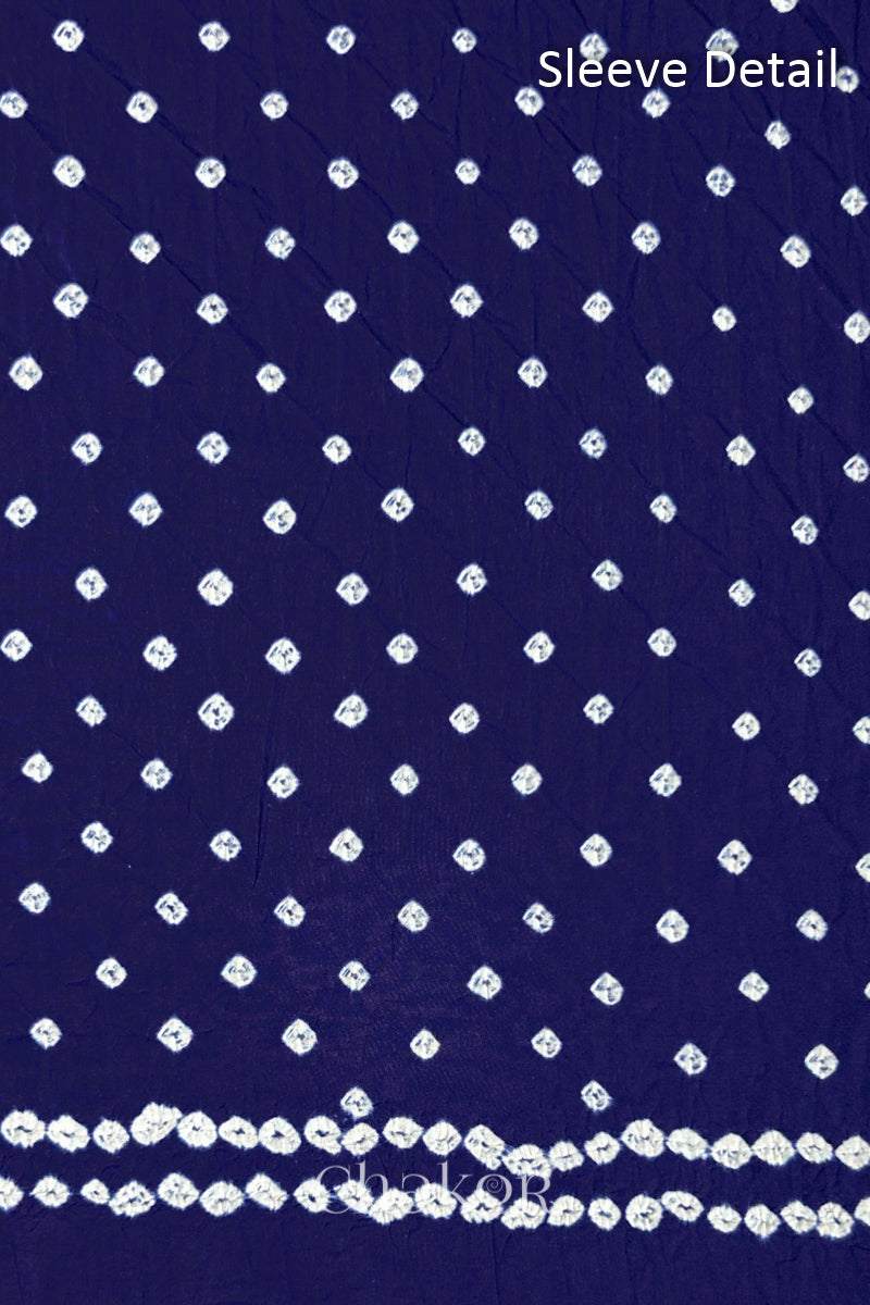 Bandhani dotted sleeve pattern on mercerised cotton fabric with handcrafted tie dye work.
