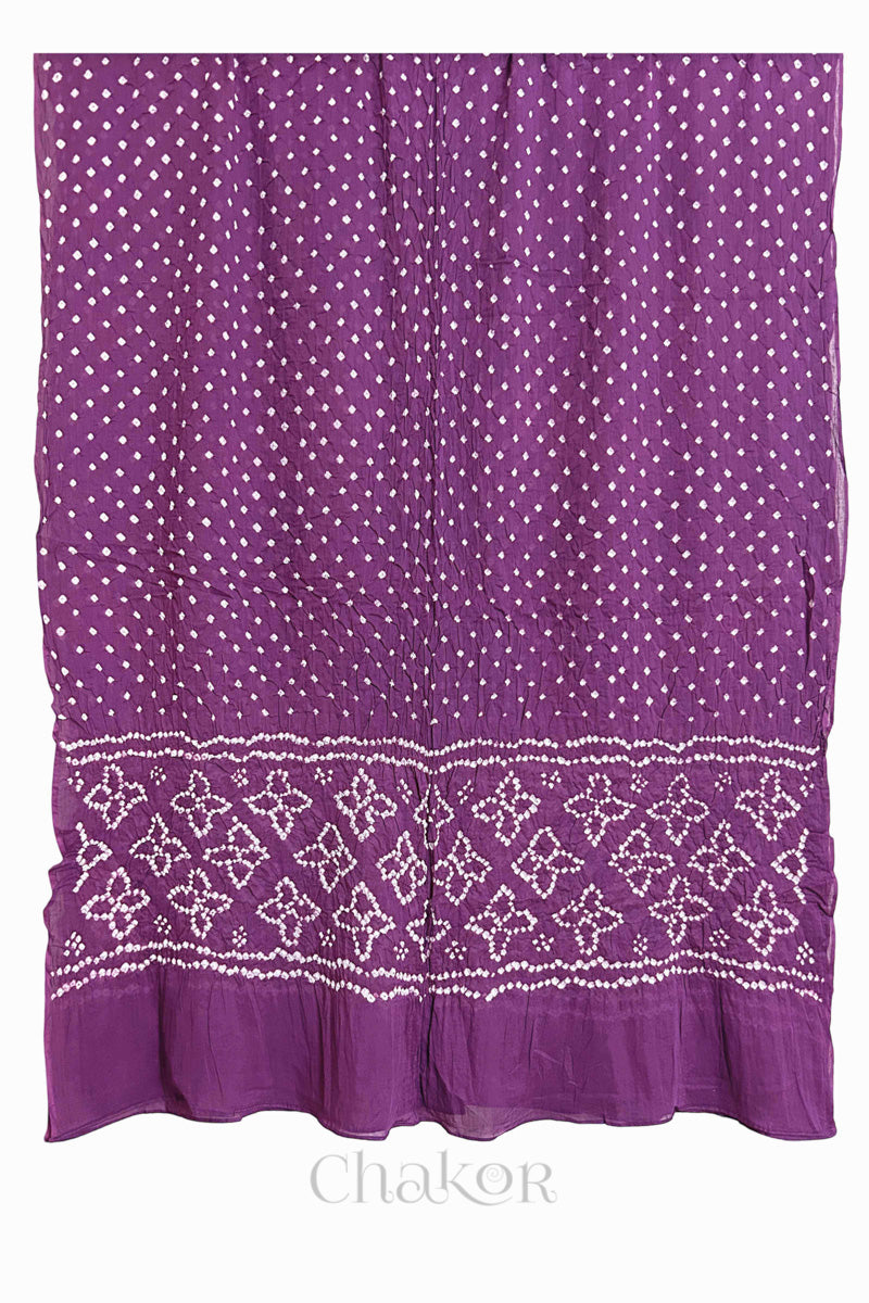 Full view of Mauve Bandhani mulmul cotton dupatta with floral pallu and dotted body pattern.
