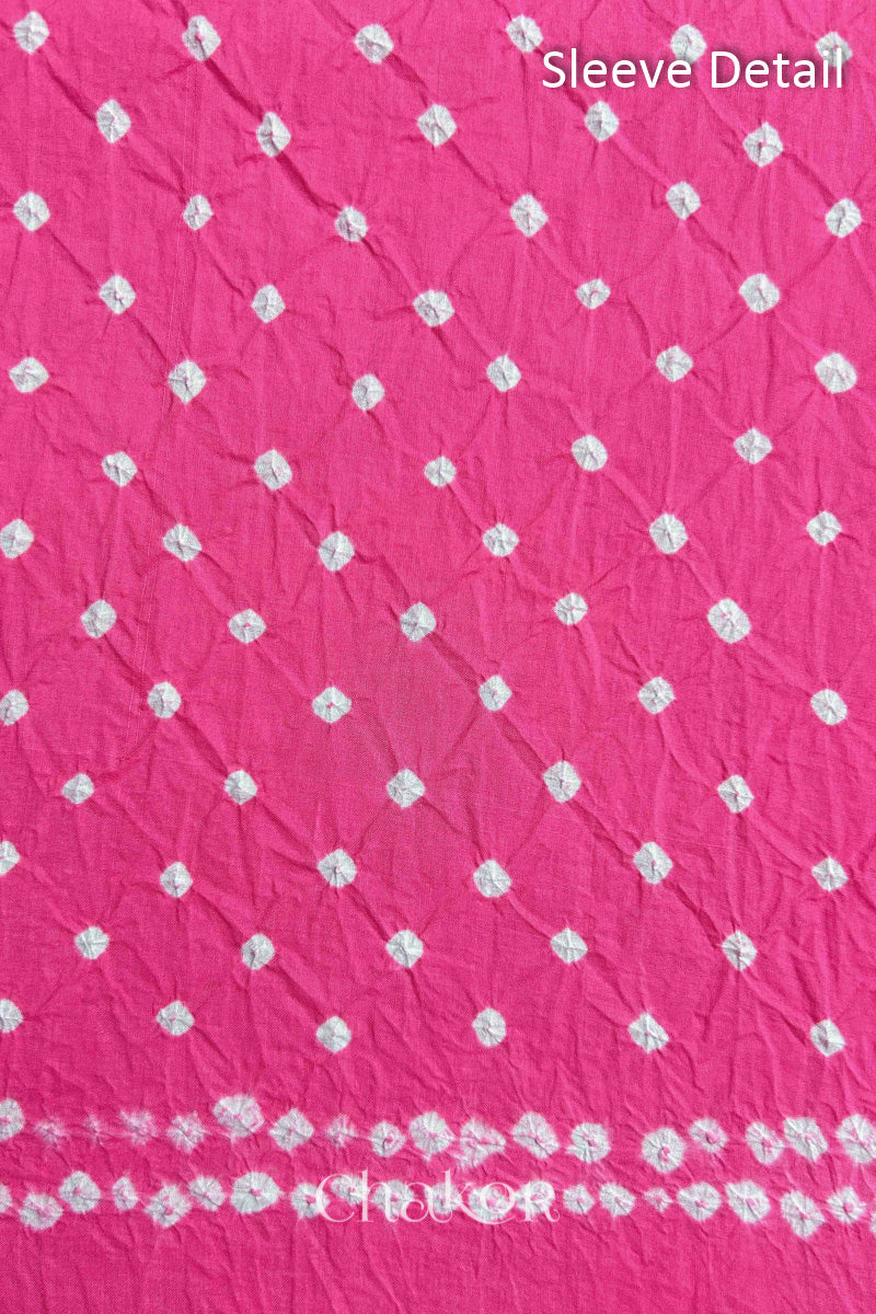 Bandhani dotted sleeve pattern on mercerised cotton fabric with handcrafted tie dye work.
