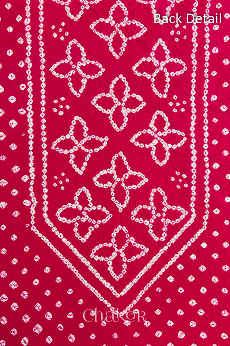 Back yoke detail featuring traditional Bandhani floral motifs on Strawberry Pink cotton fabric.
