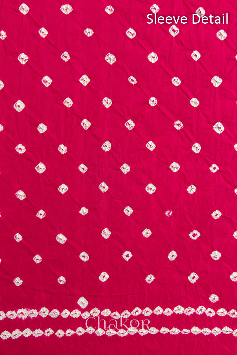 Bandhani dotted sleeve pattern on mercerised cotton fabric with handcrafted tie dye work.
