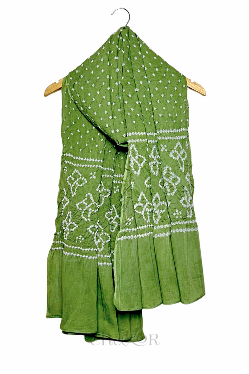 Green mercerised mulmul cotton dupatta with Bandhani floral pallu design draped on hanger.
