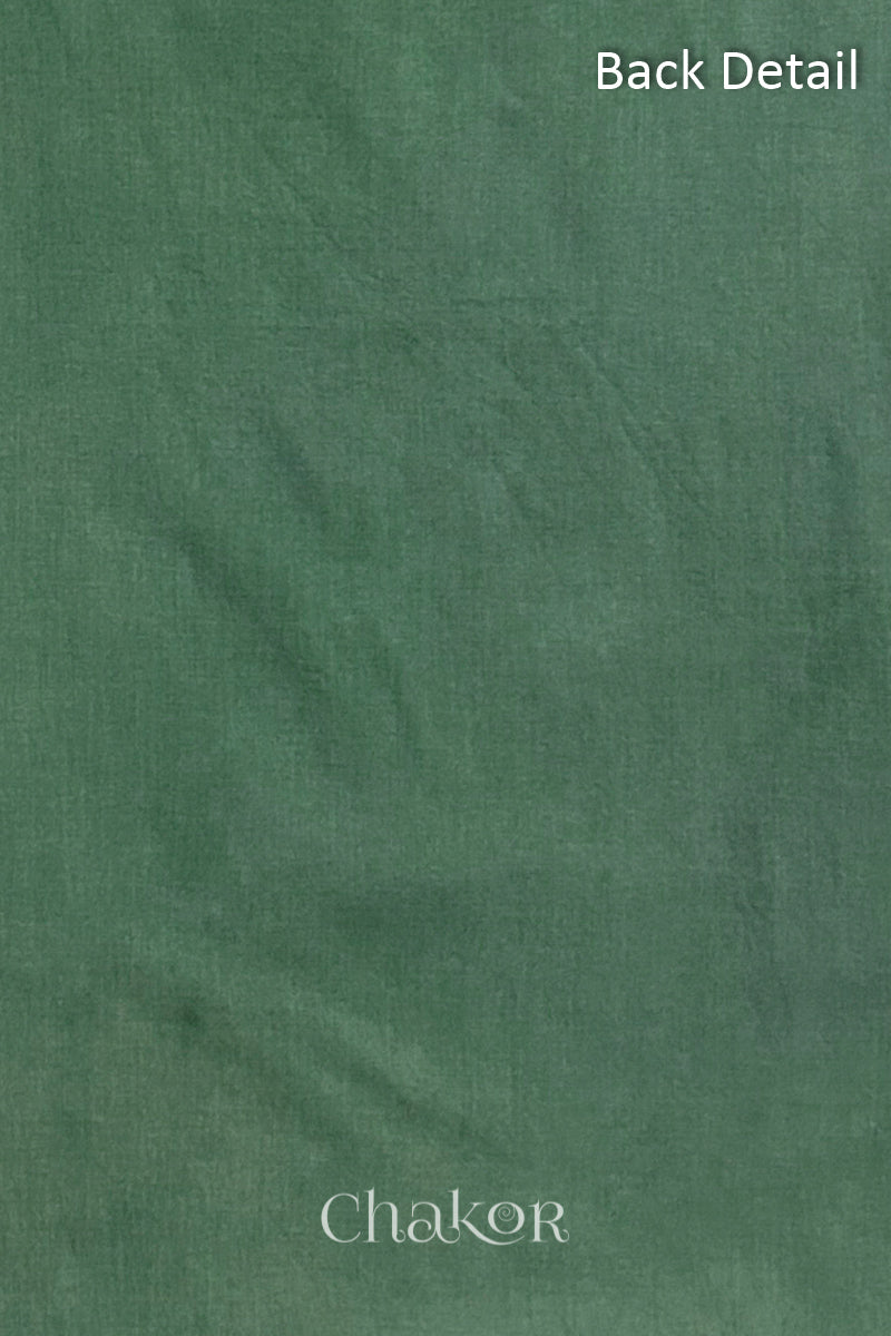 Close-up of plain back of the kurta fabric with Chakor brand logo. Text reads back detail.