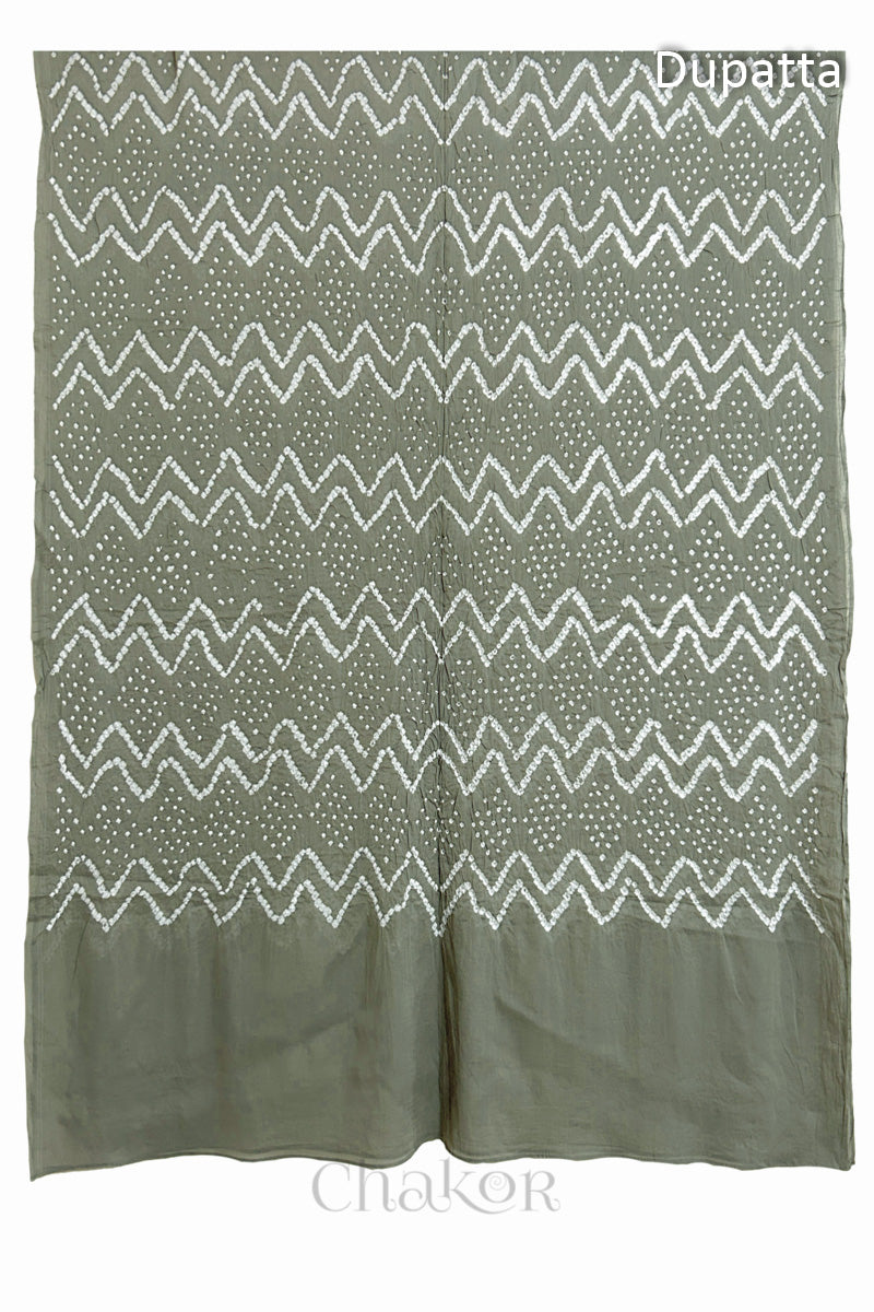 Full view of the cement grey dupatta from the kurta set with intricate zigzag bandhani patterns, with Chakor watermark. The design showcases artisanal craftsmanship.
