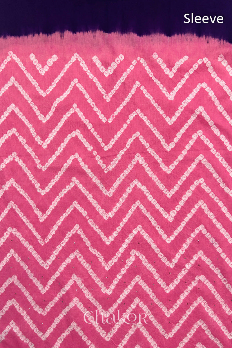 Close-up of pink bandhani fabric featuring chevron tie-dye design, with Chakor brand watermark. Text reads sleeve.
