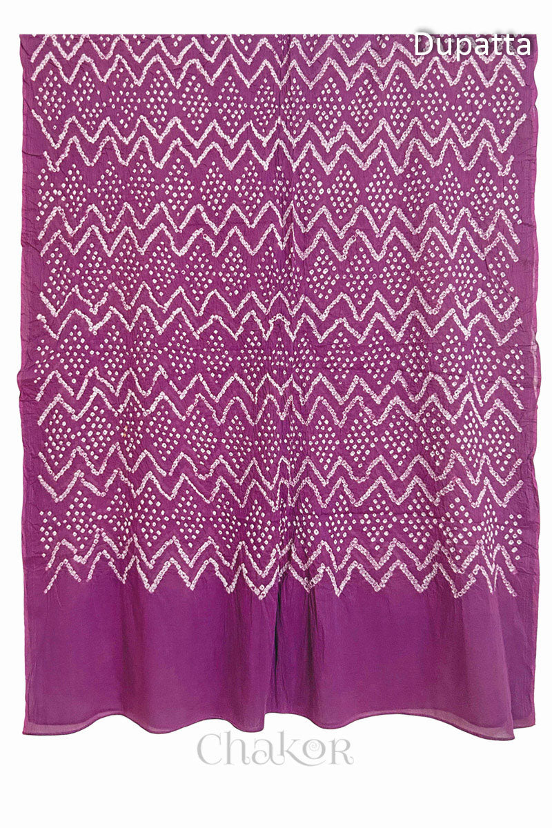 Full view of the violet puprle dupatta from the kurta set with intricate zigzag bandhani patterns, with Chakor watermark. The design showcases artisanal craftsmanship.
