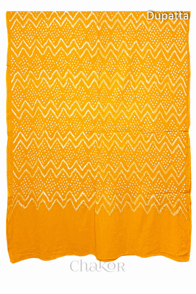 Full view of the yellow dupatta from the kurta set with intricate zigzag bandhani patterns, with Chakor watermark. The design showcases artisanal craftsmanship.
