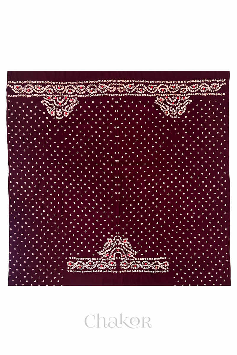 Full 1-metre layout of Maroon Popat Bandhani blouse piece showing back and sleeve motif placement.
