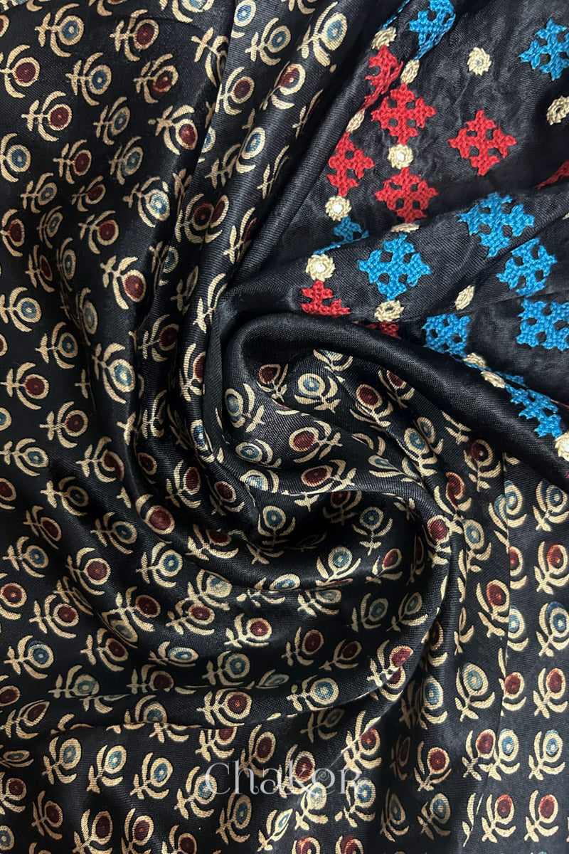 Natural dyed black Ajrakh printed Mashru silk-cotton blouse material with  Traditional Kutch hand embroidery and mirror work.