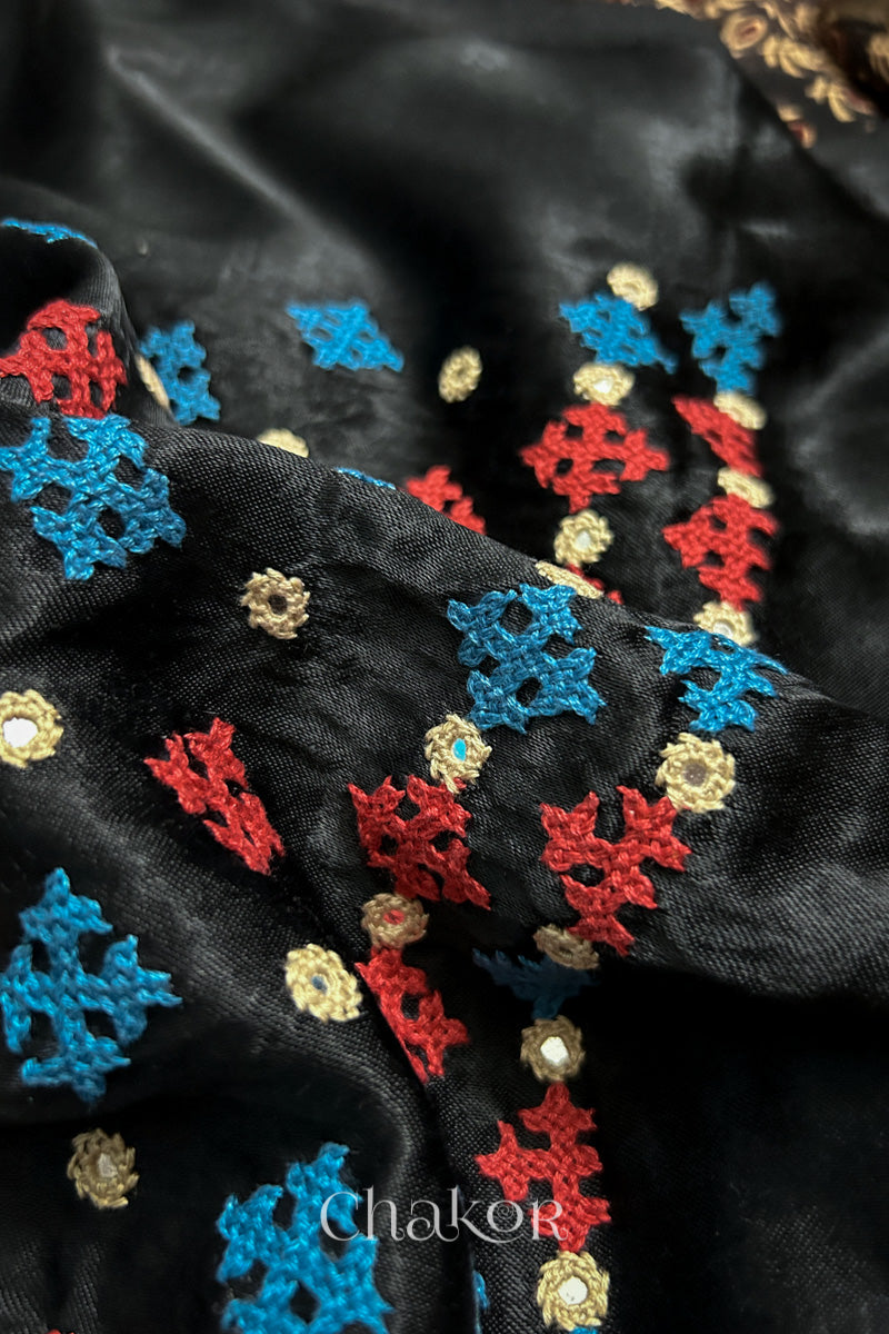 Natural dyed black Ajrakh printed Mashru silk-cotton blouse material with  Traditional Kutch hand embroidery and mirror work for sleeves.