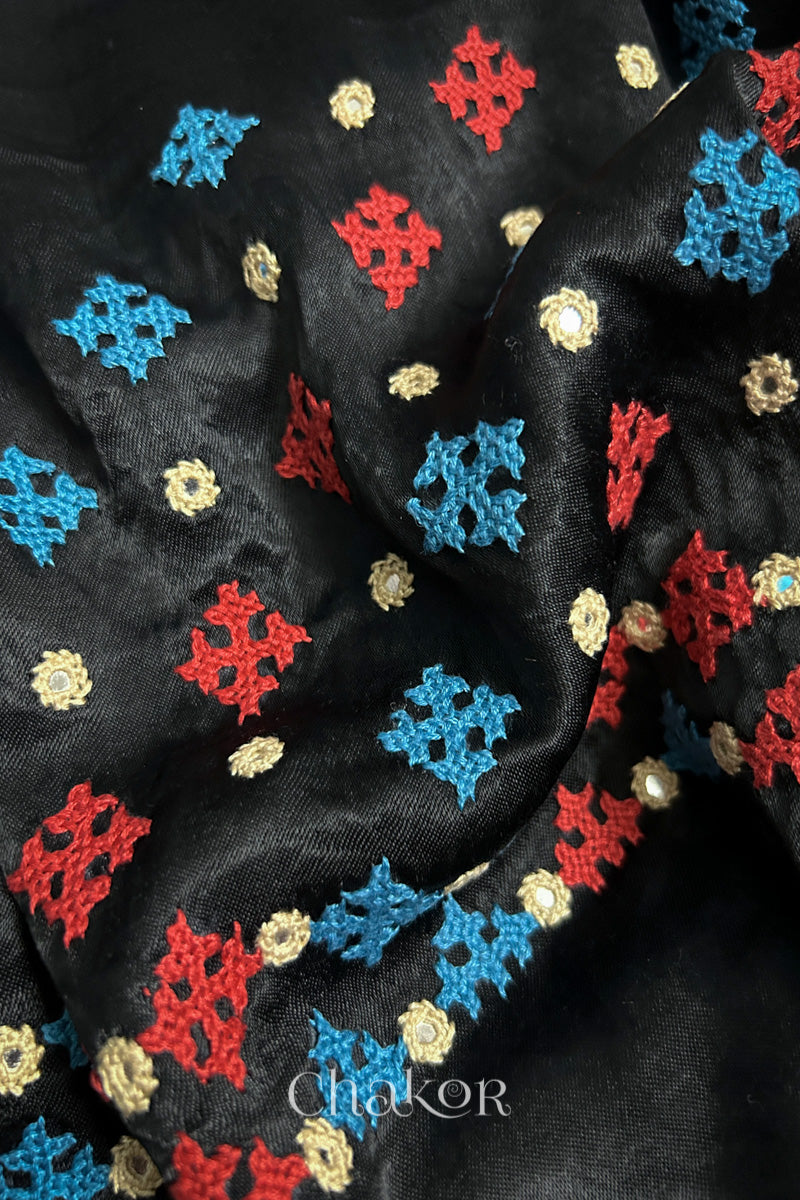 Natural dyed black Ajrakh printed Mashru silk-cotton blouse material with  Traditional Kutch hand embroidery and mirror work for sleeves.