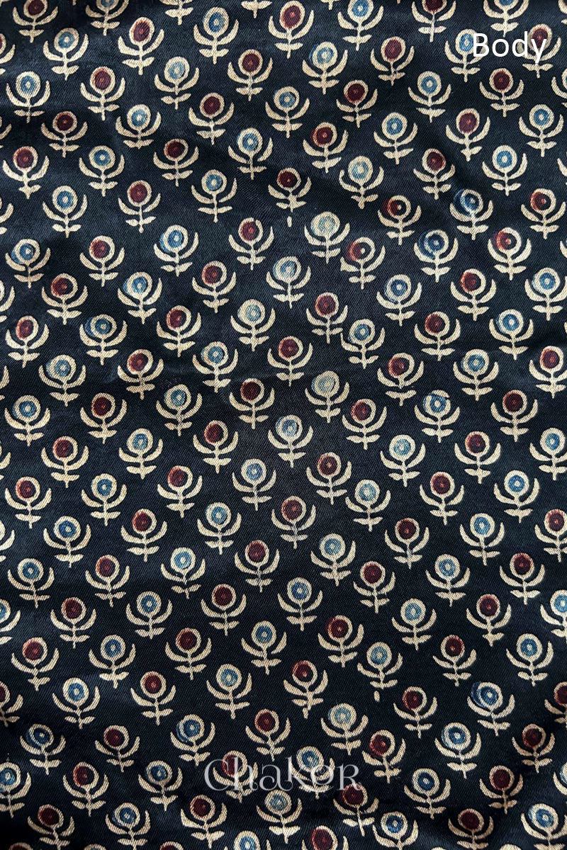 Natural dyed black Ajrakh printed Mashru silk-cotton blouse material with  Traditional Kutch hand embroidery and mirror work for sleeves.