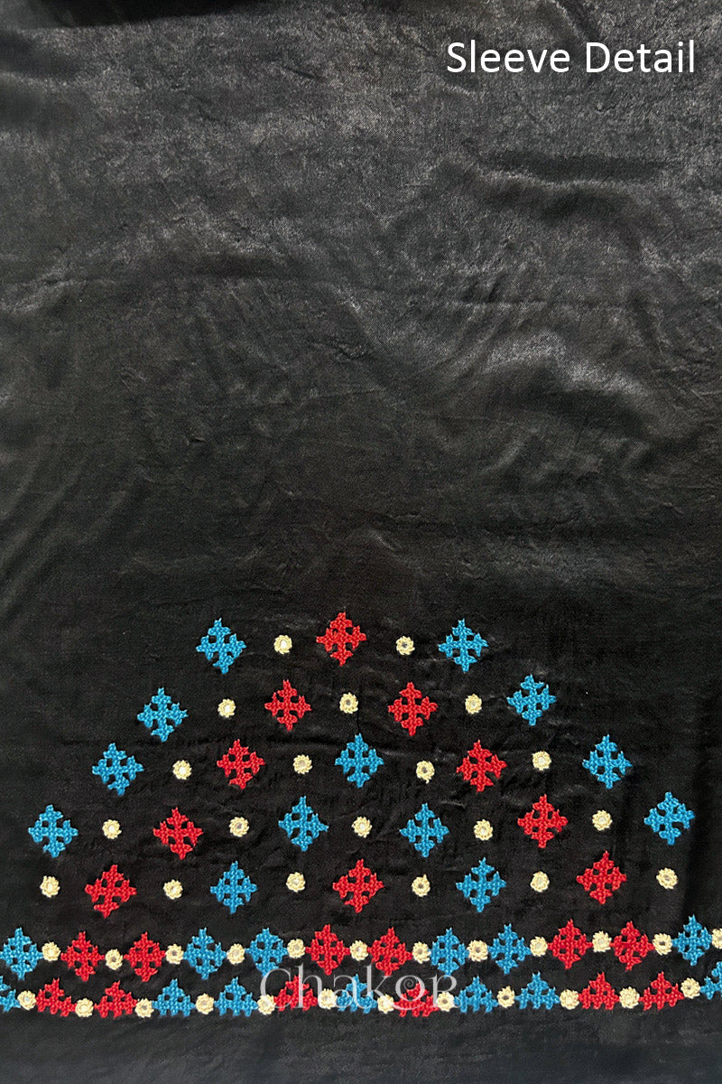 Natural dyed black Ajrakh printed Mashru silk-cotton blouse material with  Traditional Kutch hand embroidery and mirror work for sleeves.