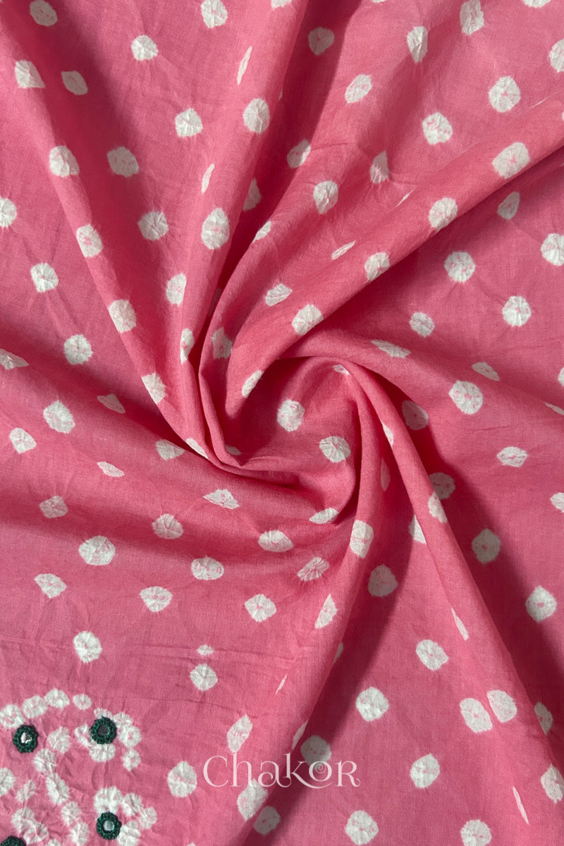 Pink Bandhani cotton blouse fabric showing fine tie-dye dots and its soft drape.
