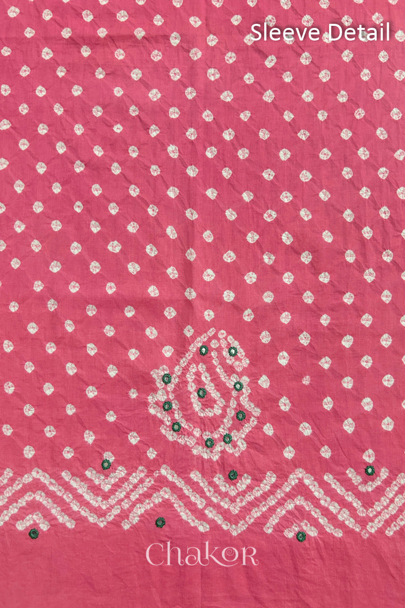 Pink Kutch Bandhani cotton fabric with white tie-dye dots and Keri motif detail for sleeves.
