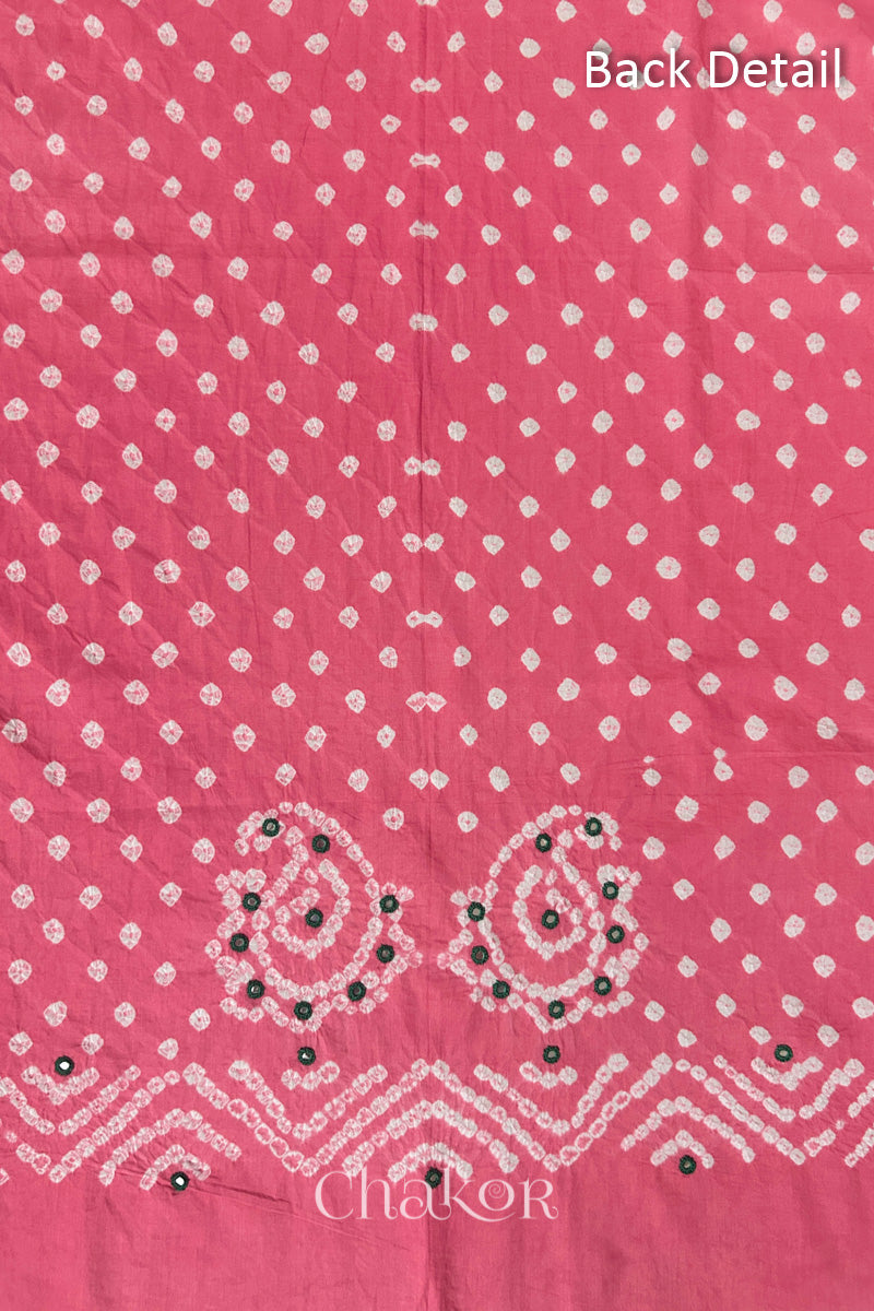 Close-up of Pink Kutch Bandhani fabric with white dotted pattern and Keri motifs for back.
